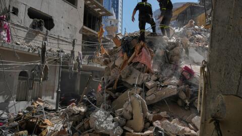 Lebanese civil defense workers inspect the rubble at the site of a building destroyed in an Israeli airstrike a day earlier in Beirut, Lebanon, Thursday, April 9, 2026. (Hussein Malla/AP)