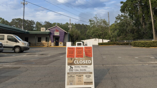 A sign outside the Humane Society of North Central Florida announced that all of its animals had been placed in foster homes as smoke from a nearby wildfire lingered over Gainesville on April 19. The shelter evacuated 40 dogs and 18 cats that day.