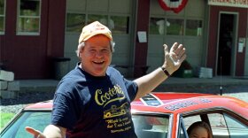 Cooter, actor Ben Jones, sits atop one of the 229 hotrods, named the General Lee, used in the show "Dukes of Hazzard" as ecstatic fan, Aliceson Johnson, of Charlottesville, Va., sits in the drivers seat in front of his store in Sperryville, Va., Tuesday, Aug. 10, 1999.