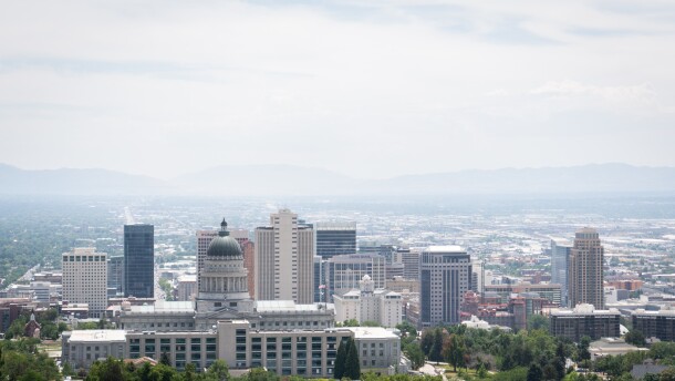 Looking south through the hazy air over the Utah State Capitol and downtown Salt Lake City from the scenic mound at the Ensign Peak Trailhead, July 27, 2022.