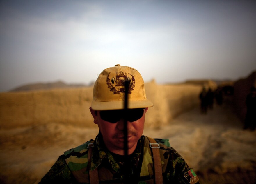 Afghan National Army platoon Sgt. Hyatulla Hakimi watches over his men while on a joint patrol.
