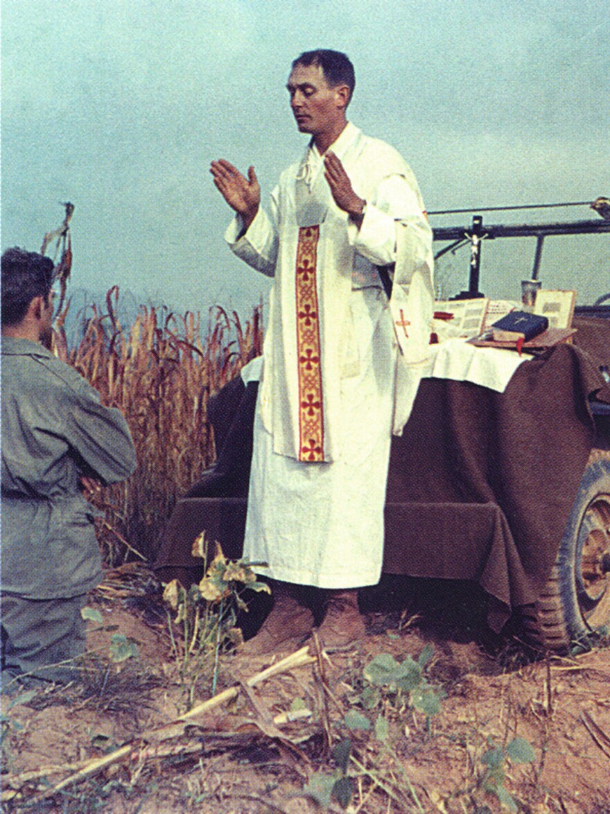 In a photo released by the Catholic Diocese of Wichita, Kapaun says Mass in the field during the Korean War.