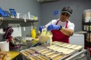 Boujee Bakery owner Joyce Watts prepares cheesecakes early in the morning at her establishment on 2311 E. 12th St. in Kansas City, Missouri. Flavors include salted caramel, Oreo, lemon, and sweet potato.