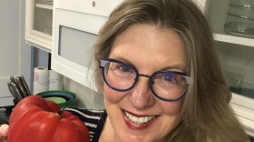 Vicki Novikoff Barnhart of Galveston, Texas, shows off her new microwave and a fresh red pepper.