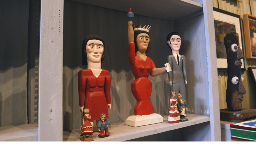 Sculptures by self-taught artist George Williams sit on a shelf in the Webb Gallery.