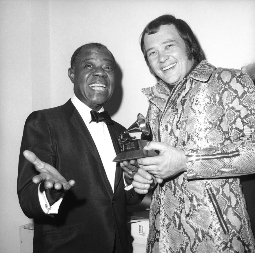 David Clayton-Thomas, lead singer of the rock group Blood, Sweat and Tears, is presented a Grammy Award by Louis Armstrong in New York on March 11, 1970. The group won three of the awards which are presented annually by the National Academy of Recording Arts and Sciences.