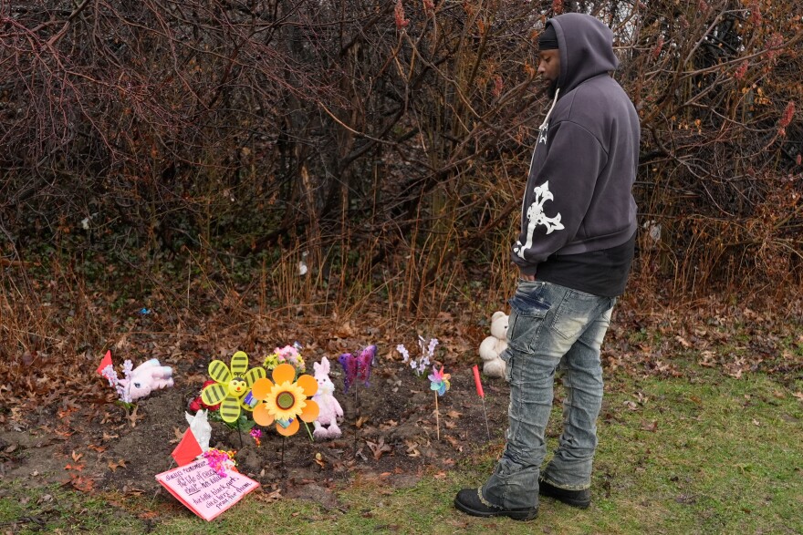 DeShaun Chatman, the father of one of the two girls whose bodies found earlier in this week, Mila Chatman, stands at the site where there is now a memorial to the girls, in Cleveland, Thursday, March 5, 2026.