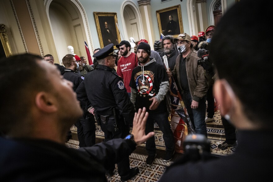 Protesters interact with Capitol Police inside the U.S. Capitol Building on January 06, 2021.