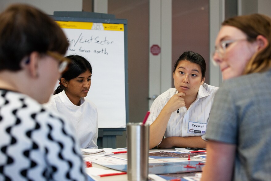 18-year-old Crystal Lee from Fairfax, Va., listens to strategies during the game.
