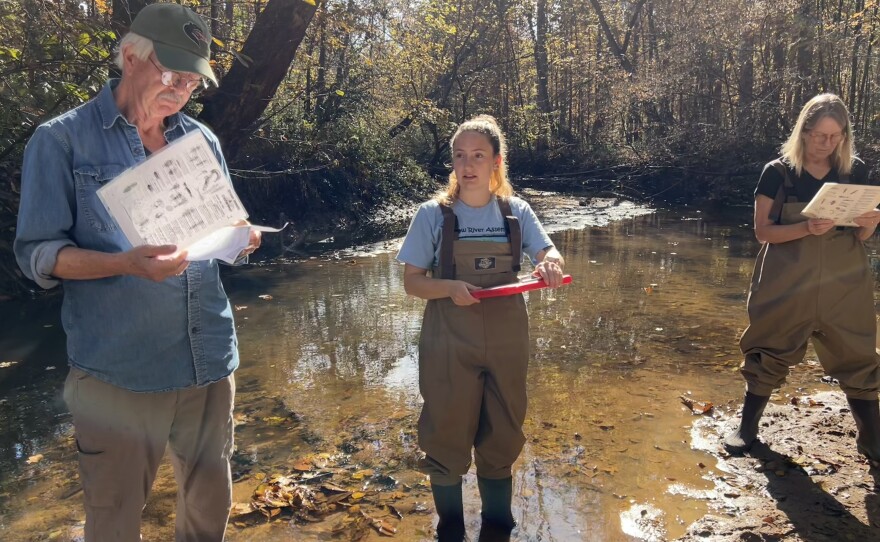 Kaitlyn Elliot, center, is the water quality program manager at the Haw River Assembly. She leads a training on November 8, 2025 for volunteers joining the Haw River Watch Program. To the left is volunteer Paul Brown; to the right is voluneer Anne Kac