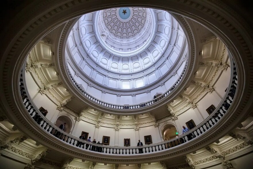 An upwards view of the capitol dome from inside the building. 