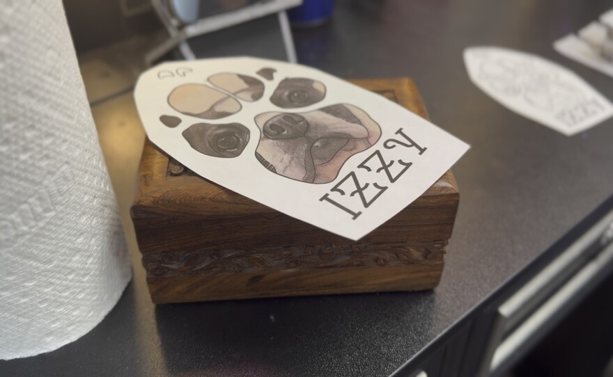 Cheyenne Rollerson had been carrying her dog’s ashes for 6 years. And for one young mother…the answer was a place where she'd never have to let go. Izzy was a Boston terrier who passed away after being bitten by a rattle snake while protecting the families two young siblings who were also playing outside at the time. Rollerson honored her beloved pet by mixing a small amount into tattoo in and then added into a tattoo at artistic soul tattoo in Chiefland. What people decide about their end of life arrangements can say *everything* about how they lived. We met with three families who chose a *different* kind of goodbye. One by land, one by water and another just under the skin.