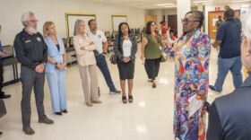 Deirdre Benka-Coker, Principal of McNicol Middle School gives a tour of her school to Broward community members and supporters of the Overtown Youth Center