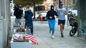 Flowers and an American flag, placed at the scene a day after two National Guard soldiers were shot near the White House in Washington, Thursday, Nov. 27, 2025. (Cliff Owen/AP)