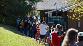 Voters wait in lines outside a St. Louis County polling site at the Ballwin Golf Course and Events Center on Election Day Tuesday, November 3, 2020.