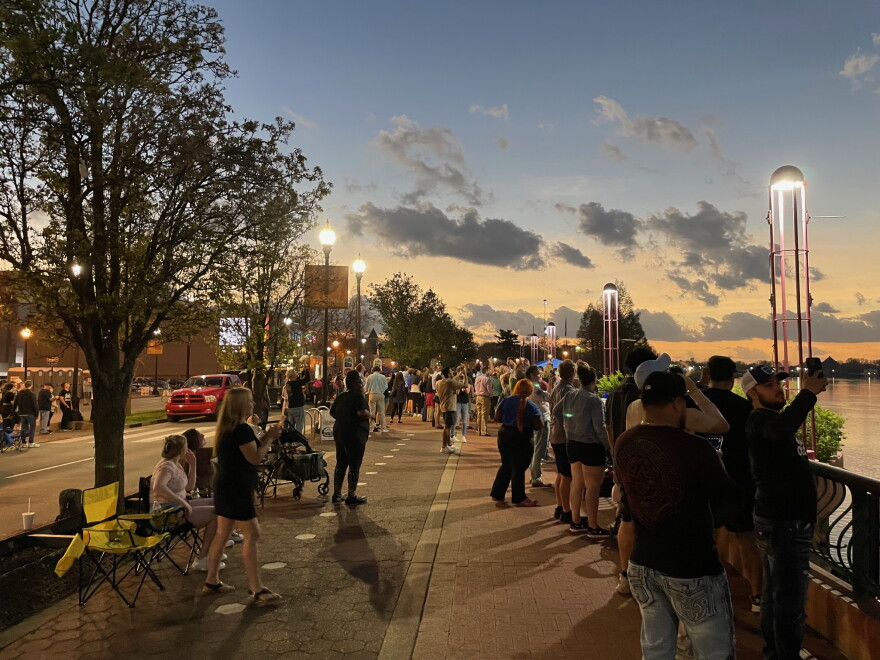 An eerie twilight settled over the riverfront during totality