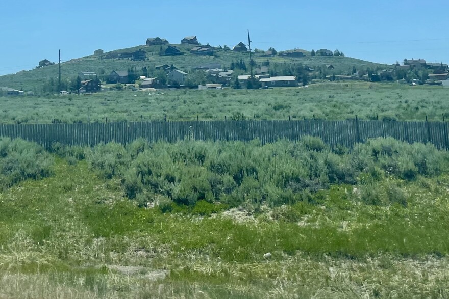 the highland flats land is seen from I-80 beneath Highland Estates in 2023