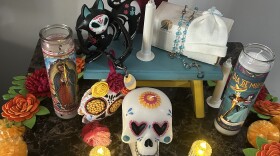 LCC Strategic Enrollment Management Support Specialist Katerin Niño's ofrenda that features her pet Oliver's collar and her infant son Issac's ashes.