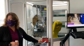 iA employee demonstrates automation technology.