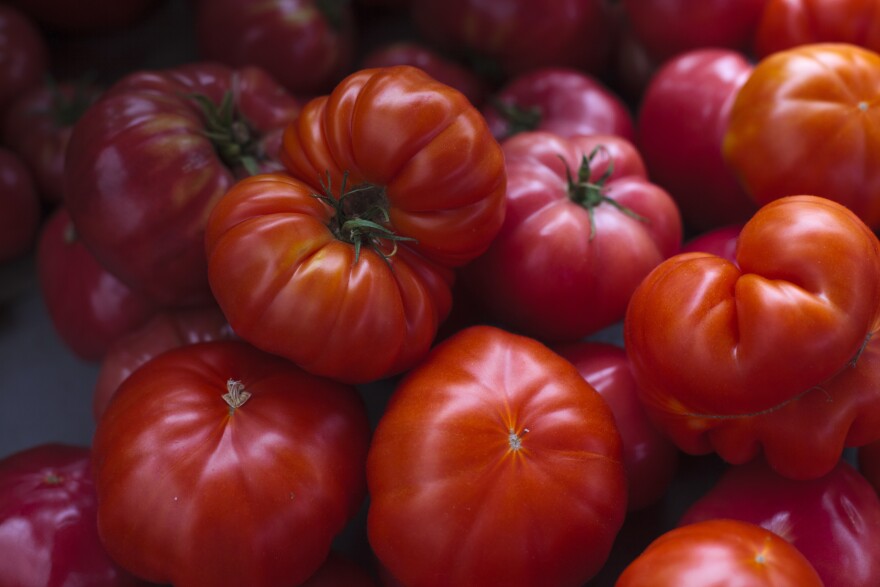 Heirloom tomatoes are displayed for sale at a farmers market in Falls Church, Va., Saturday, July 28, 2017. (AP Photo/J. Scott Applewhite)