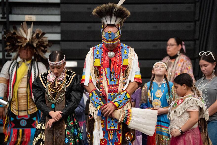 FILE - Members of the Lumbee Tribe bow their heads in prayer during the BraveNation Powwow and Gather at UNC Pembroke, March 22, 2025, in Pembroke, N.C.