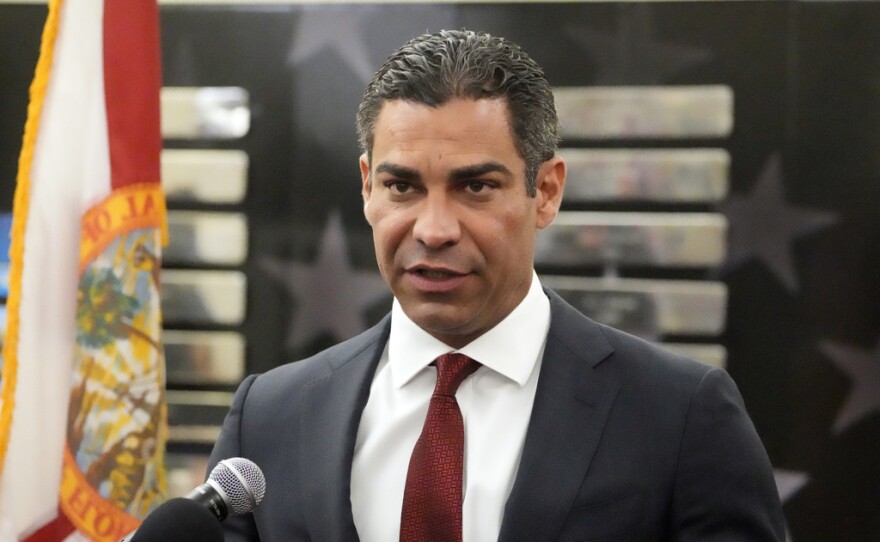 A man speaks at a news conference.