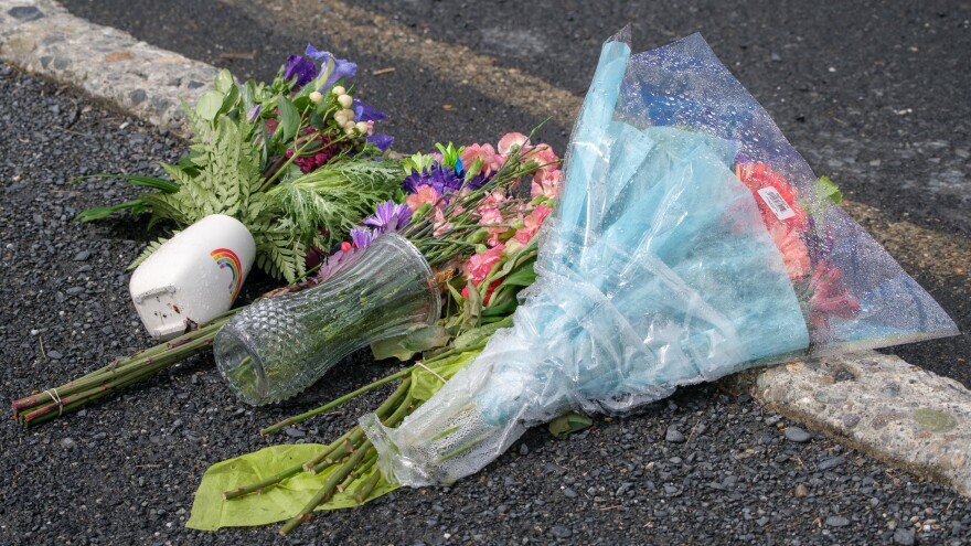 A close up of flowers left on the edge of Rezanof Dr., July 17, 2023. (Brian Venua/KMXT)
