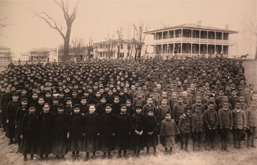 The students of the Carlisle Indian School in Pennsylvania are amassed on the grounds of the school in March of 1892.