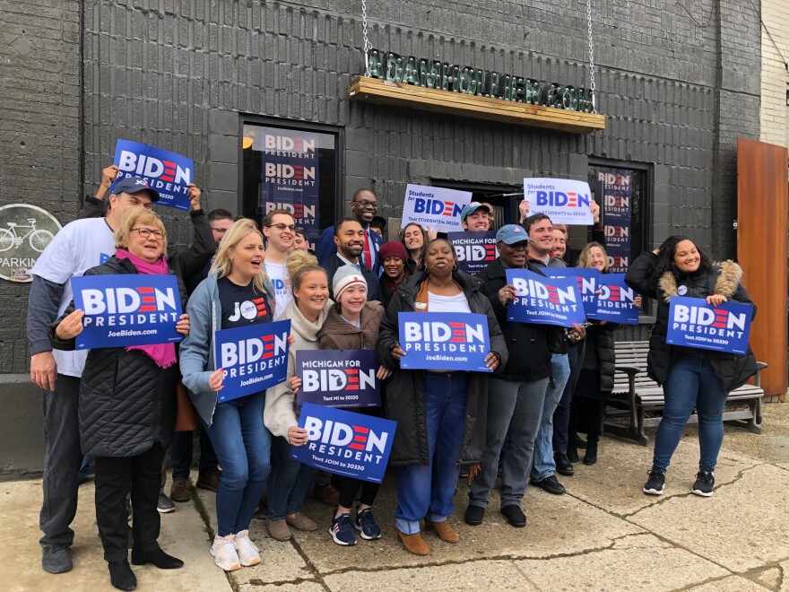 Michigan Lt. Gov. Garlin Gilchrist, at center back in red tie, has endorsed Joe Biden and recently helped celebrate the opening of a field office in Detroit's Arden Park neighborhood.