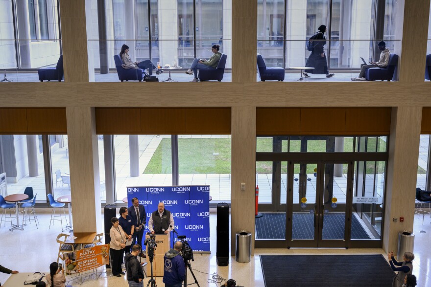 Students study and move between classes inside UConn's Hartford campus during a press conference to announce the opening of a food pantry for staff, faculty and students. Husky Harvest pantries opened last semester at UConn's campuses in Stamford, Avery Point and Waterbury.