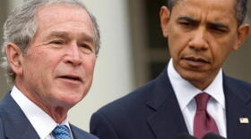Former President George W. Bush, standing with President Obama, speaks about relief efforts in Haiti in January 2010.