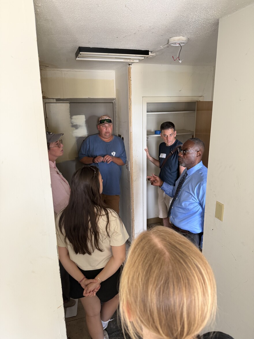 Dodson shows planning board members an apartment with severe water and mold damage.