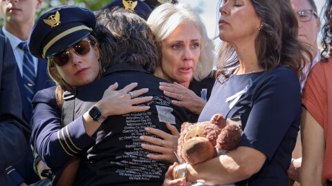 National Transportation Safety Board Chair Jennifer Homendy, center, helps to comfort Christina Stovall, center with back to camera, and Laura Augendre, right, family members of victims of flight 5342, the deadly Jan. 2025 midair collision between an American Airlines plane and a Black Hawk helicopter over the Potomac River, during a news conference on air safety reforms, at the Capitol in Washington, Tuesday, Sept. 15, 2026.