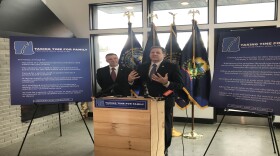 Vermont Gov. Phil Scott joins New Hampshire Gov. Chris Sununu to announced their joint paid family and medical leave plan at Schilling Beer Co. in Littleton, N.H.