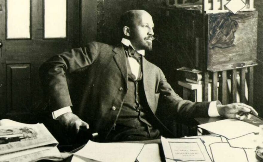 W. E. B. Du Bois, seated at his desk, Atlanta, Georgia, 1909.
