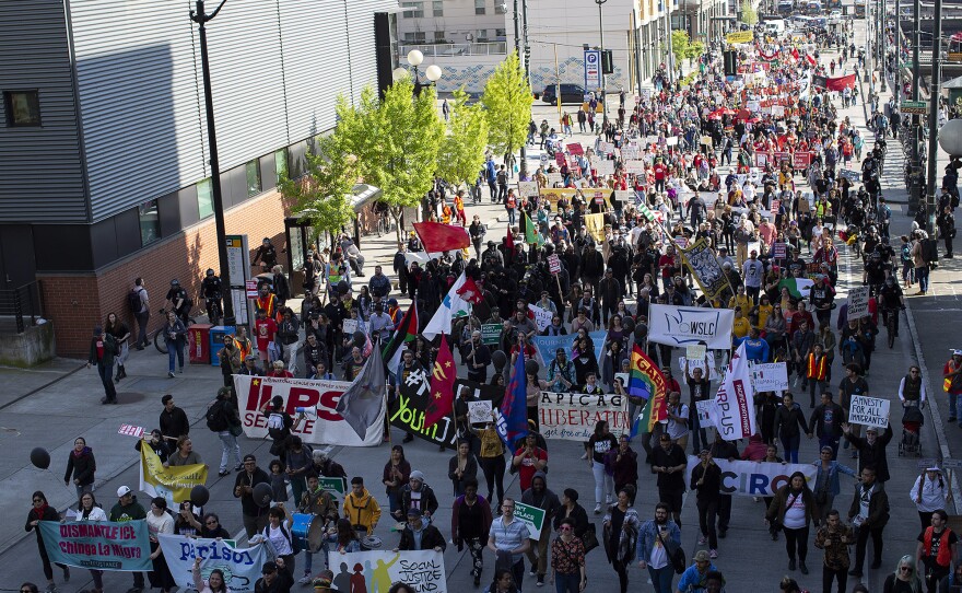 People march through Seattle on May Day 2018 to advocate for immigrant rights.