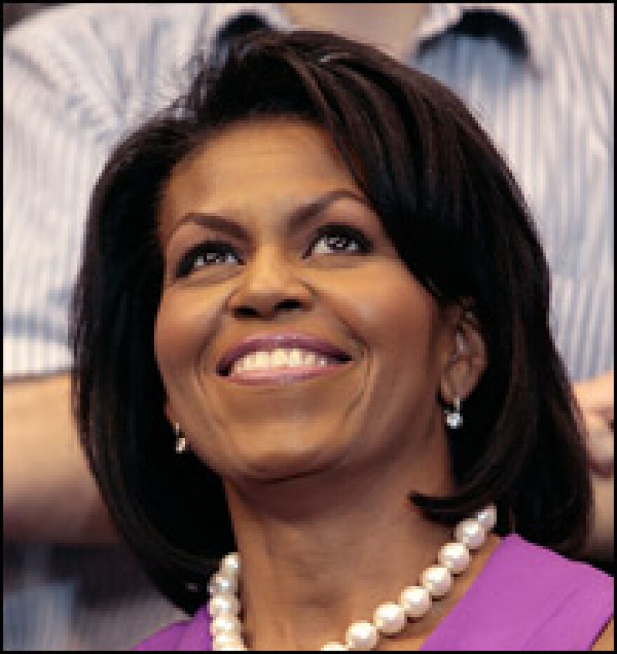 Michelle Obama watches her husband Democratic presidential hopeful Sen. Barack Obama during a rally on June 3, 2008 in St. Paul, Minnesota.