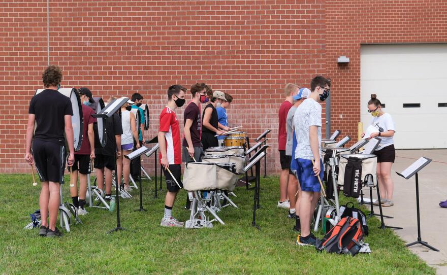 The Valley Center High School drumline waits for instructions during rehearsal. (Photo by Brian Grimmett, Kansas News Service)
