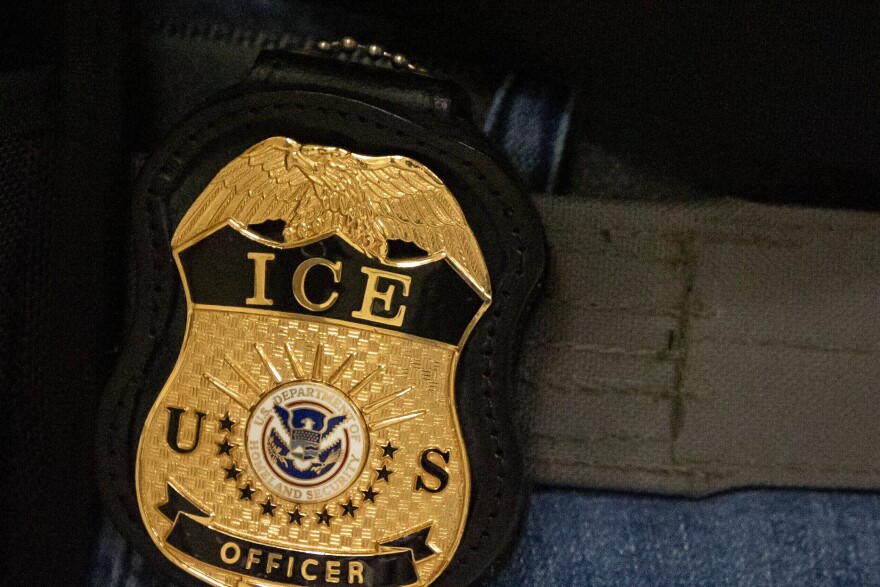 FILE - A federal agent wears an Immigration and Customs Enforcement badge in New York, June 10, 2025. (AP Photo/Yuki Iwamura, File)