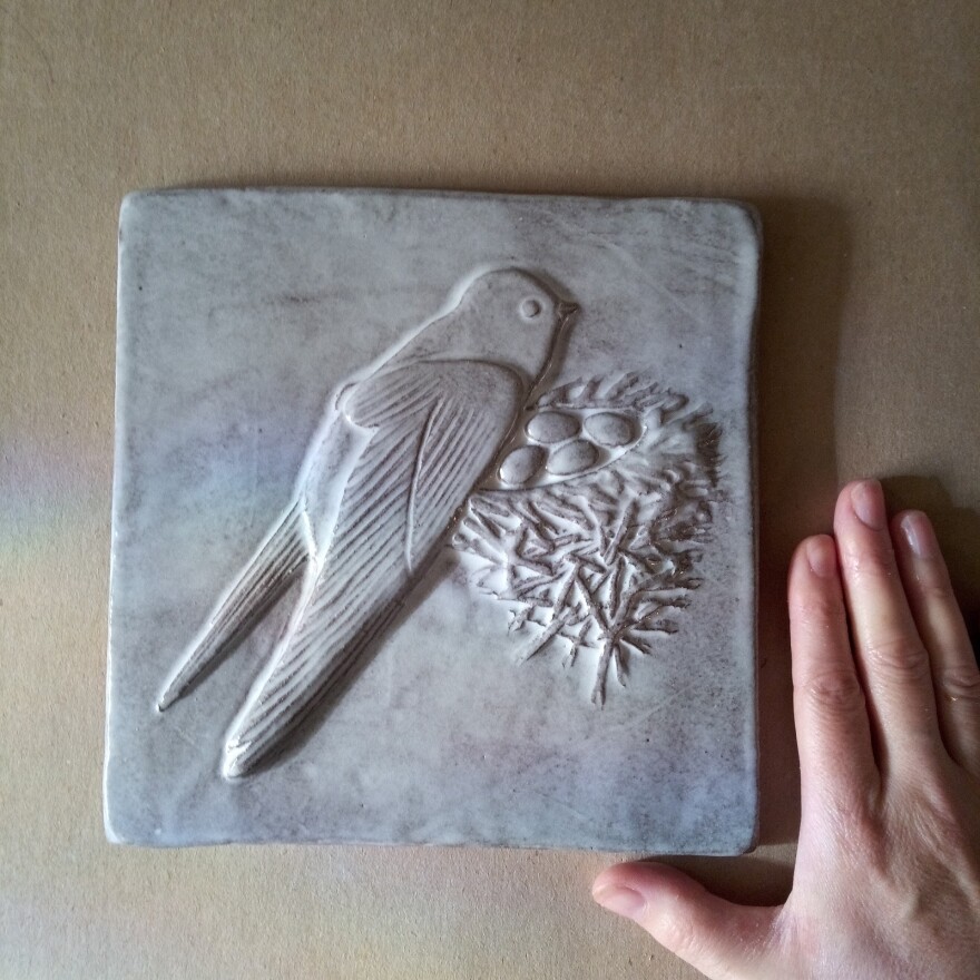 Emily Ulm shows a ceramic mold she will use to create the chimney swift tiles. "With all my work, I create an original design using sculpting tools," Ulm said.