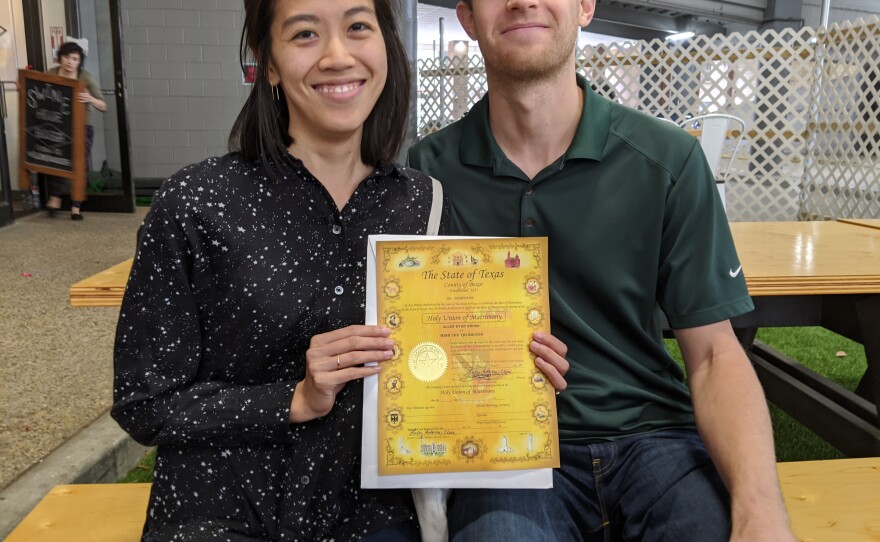 Thu and Alan with their marriage license.