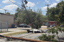 Storm damage at Flores and Cypress streets in San Antonio, where high winds brought down utility poles, power lines and tree limbs following Friday night’s severe storms.