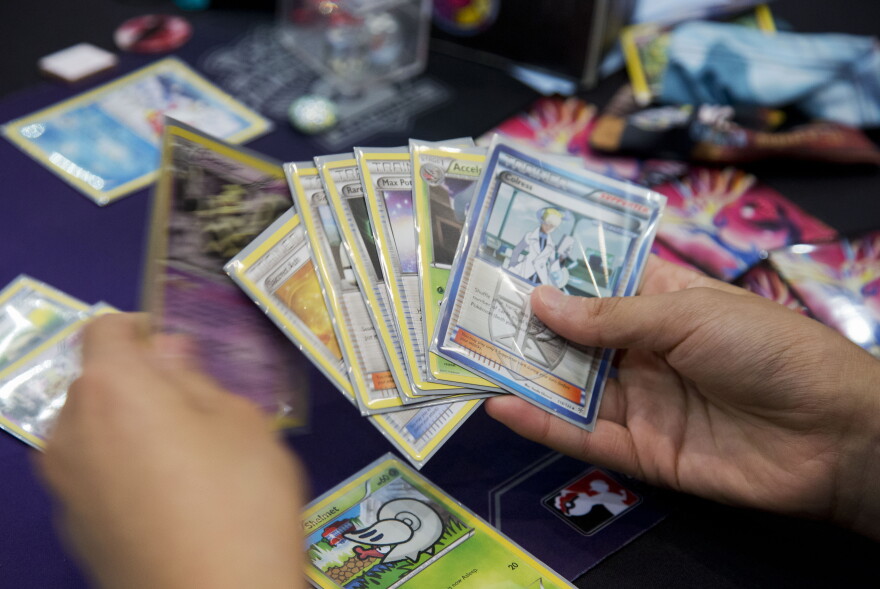Cards being held in someone's hands