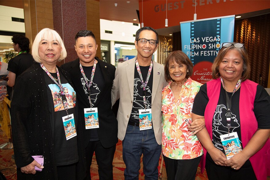 Attendees at the Las Vegas Filipino Short Film Festival smile at the camera.