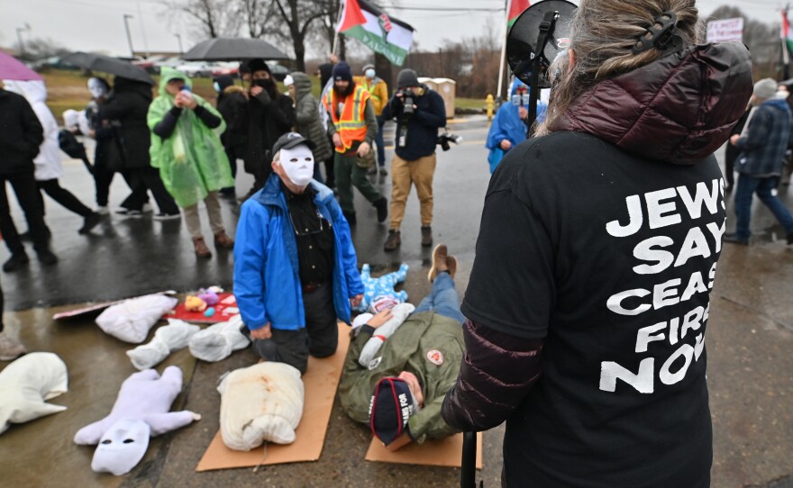 Ariel Gold, executive director of the Fellowship of Reconciliation, wears a “Jews Say Cease Fire Now” shirt and shouts for change in the Israeli occupation of Gaza.