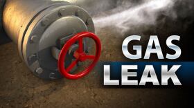 Image of pipe and valve with the words 'gas leak'