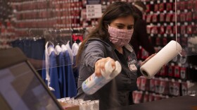 LeeAnna Murphy, disinfects her work area at Spangdahlem Air Base, Germany, April 30, 2020. COVID has produced various changes in the workplace.  Experts say some will last but not be as drastic as some people think, while others may be temporary.