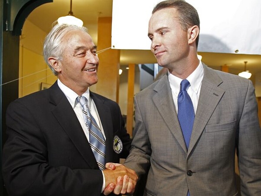 Attorney General Bill Sorrell, left, and his Democratic primary election opponent T.J. Donovan, shake hands on Wednesday in