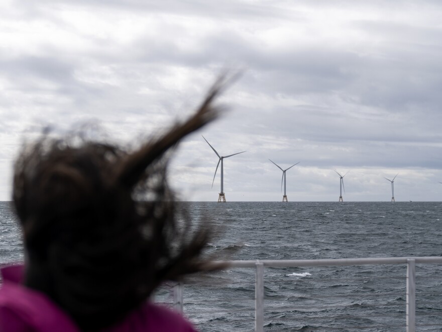 Guests tour America's first offshore wind farm off the coast of Rhode Island, Oct. 17, 2022. Part of the bipartisan Infrastructure Bill included funding for green energy initiatives to combat climate change.