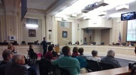 Lexington City Councilmember Chuck Ellinger, at podium, asked a council committee Tuesday to set aside $400,000 he said would attract another $1.6 million to fund a microtransit study. His request didn't receive a vote.